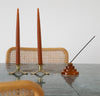 The Amber Glass Meso Incense Holder on white background.