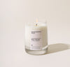 Yield 8oz Palo Santo Candle on a cream background.