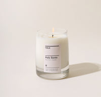 Yield 8oz Palo Santo Candle on a cream background.