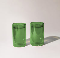 Two 12 oz Verde Double Wall Glasses on a cream background. 