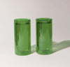 Two 16 oz Verde Double Wall Glasses on a cream background. 