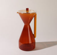 The Amber Pour Over Carafe on a cream background. 