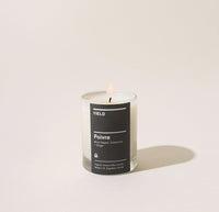 Yield 6oz Poivre Candle on a cream background.