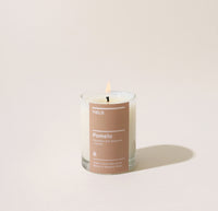 Yield 6oz Pomelo Candle on a cream background.