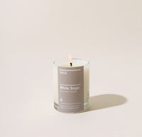 Yield 2.5oz White Sage Candle on a cream background.